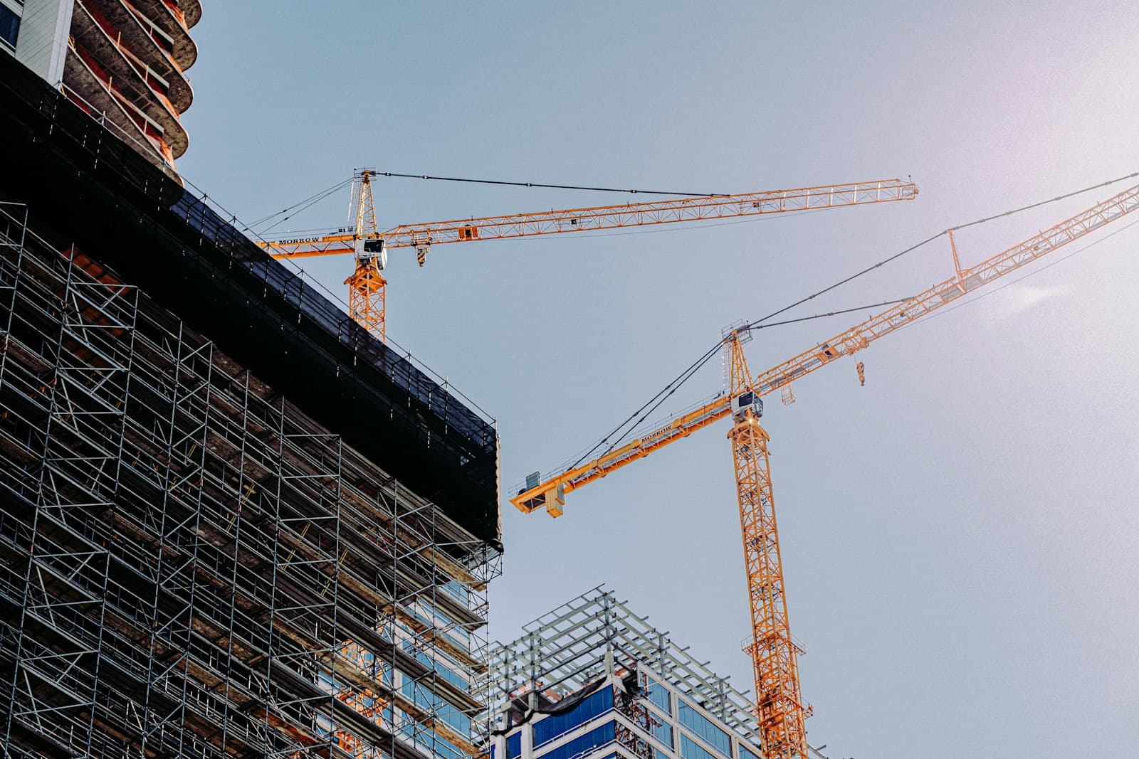 A tower crane beside a building under construction